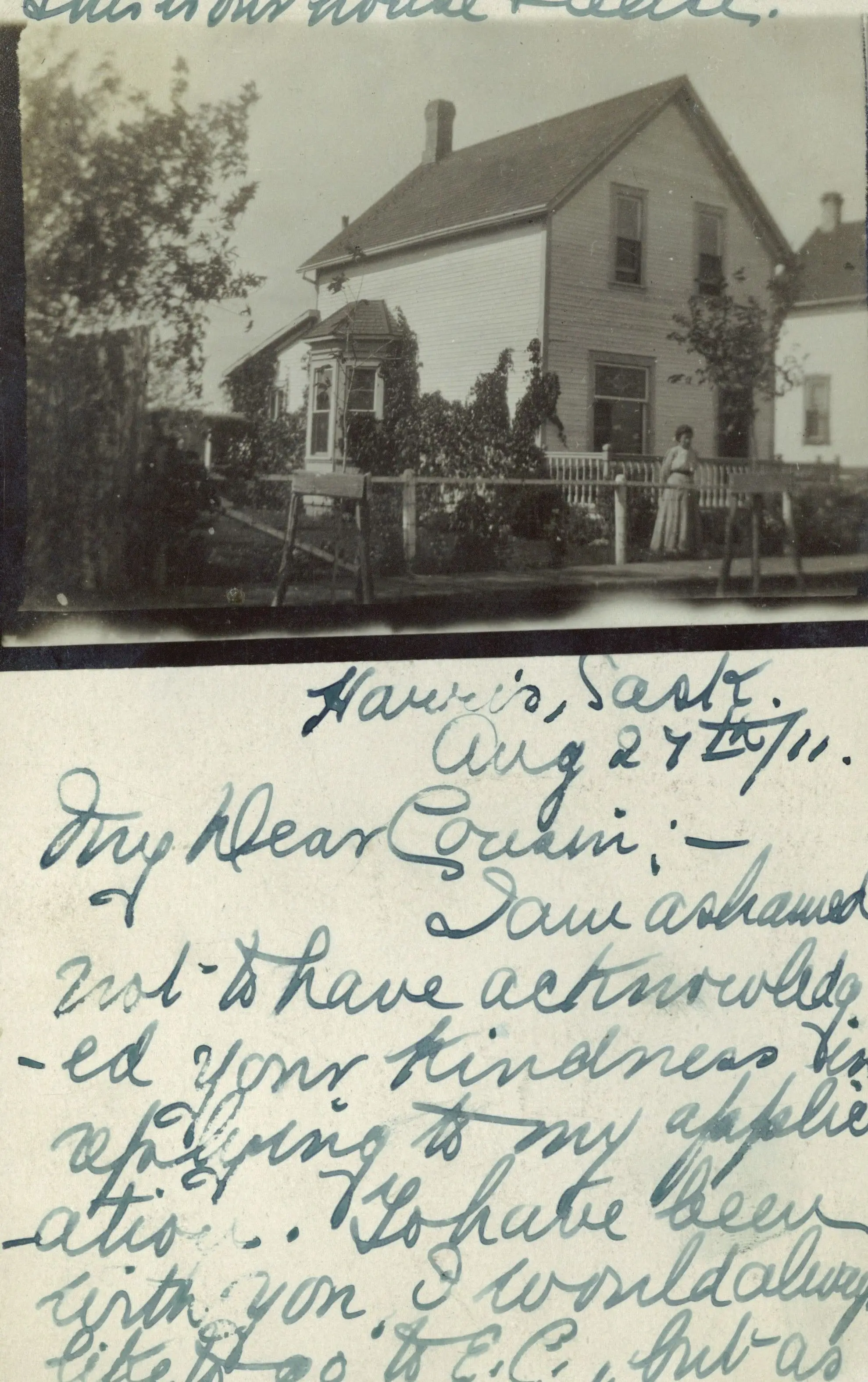 House in Harris with woman in the yard (postcard)