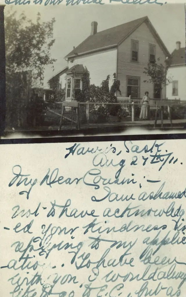 House in Harris with woman in the yard (postcard)